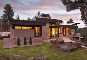 Custom built green home with stone and large windows