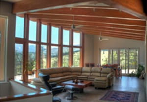 Fire Rebuild - Living room with curved vaulted ceiling and spectacular views