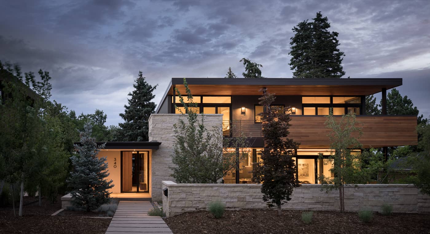Exterior of modern custom home with stone and wood detailing