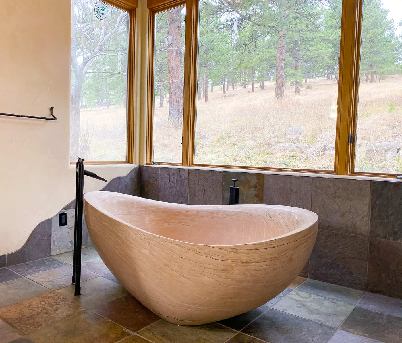 Light-filled bathroom with 2 ton freestanding stone tub