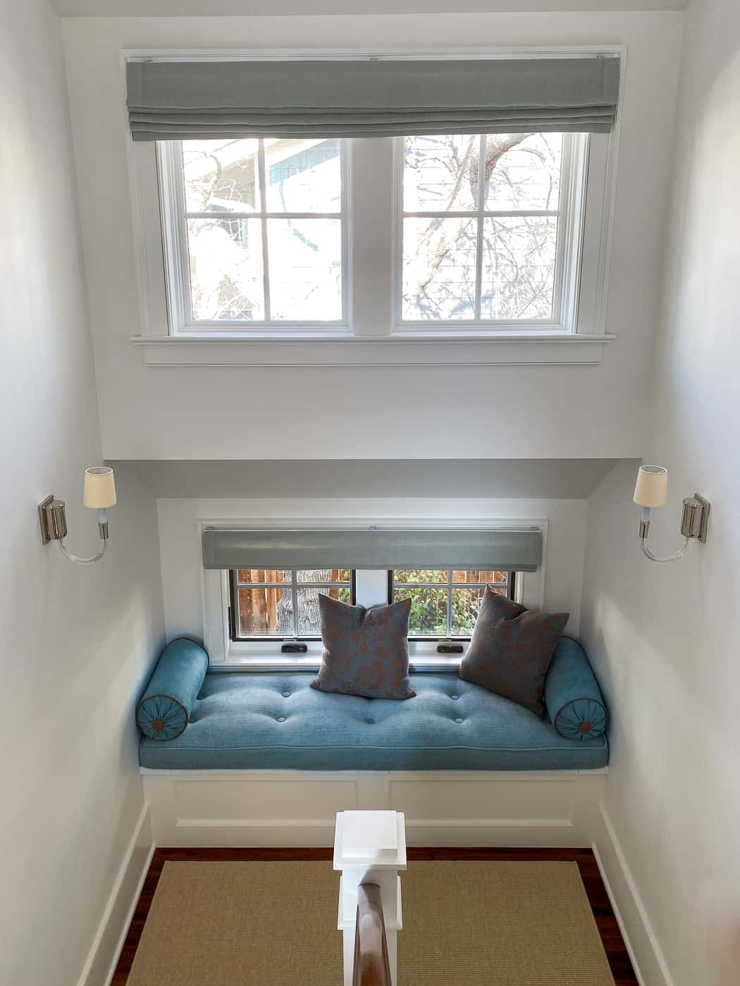 Staircase landing with upholstered window seat