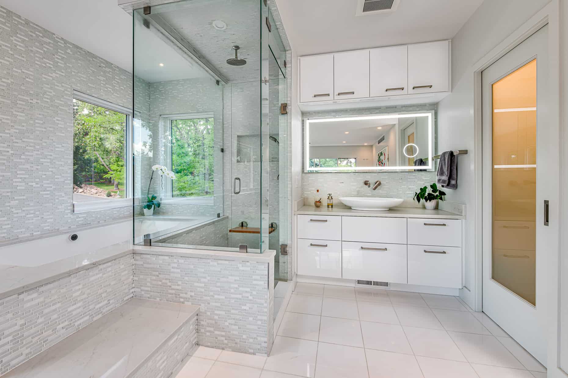 Master bathroom with glass surround shower and large windows