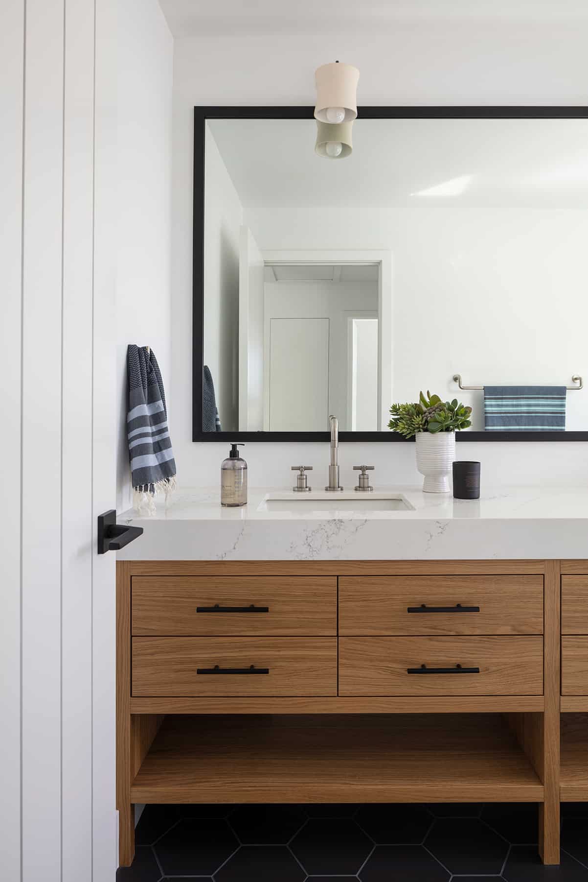 Bathroom vanity in home by Cottonwood Custom Builders