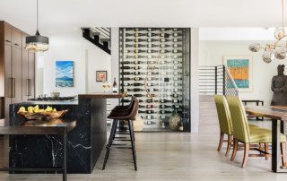 The clean, modern wine storage in this home extends through three floors of the house!