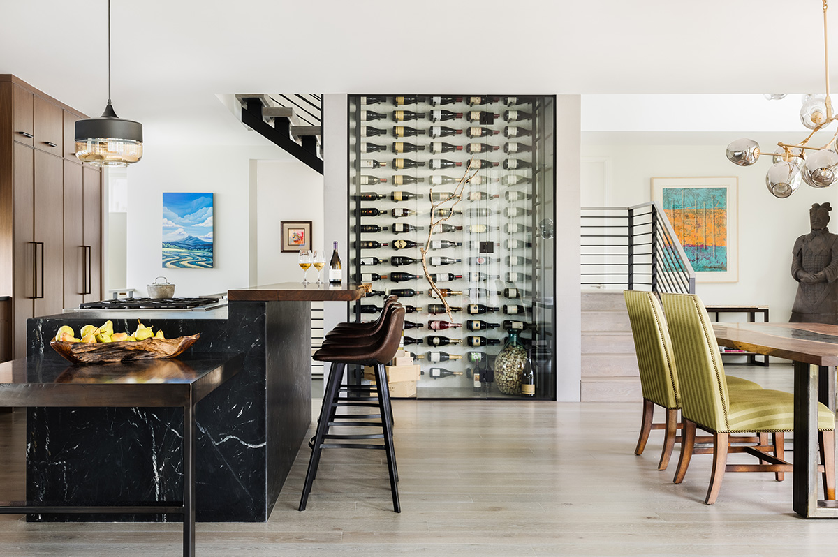 The clean, modern wine storage in this home extends through three floors of the house!